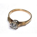 A cubic zirconia ring set in 9 carat gold