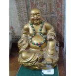 A bronze effect plaster figure of Hotei, 28 cm high