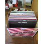 A collection of fifty 12" vinyl long playing records from the 1960s and 1970s including The Hits