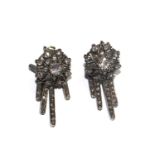 A pair of vintage diamond earrings