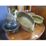 A brass oval jardiniere, with lion mask handles and gadrooned sides, on paw feet, 45 cm wide,
