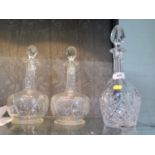 A pair of cut glass crystal decanters and another (3)