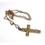 A gold coloured metal cross on a 9 carat gold chain