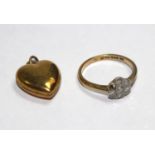 A diamond posy ring set in 18 carat gold (one stone missing) and a heart pendant (2)