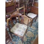 An Edwardian inlaid mahogany corner armchair on turned legs, and two inlaid bedroom chairs (3)