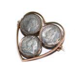 Three Victorian silver pennies on a 9 carat gold heart shaped frame