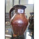 A Trevor Corser single handled vase, with brown streaked glaze, Leach Pottery and personal stamps,