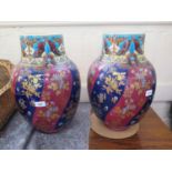 A pair of 19th century French Majolica vases, the blue and red spiral design with all over gilt