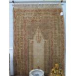 A Persian style prayer rug, the sand field within a multiple border with repeat pattern, 155 x 88 cm