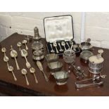 A COLLECTION OF SILVER AND WHITE METAL ITEMS to include pepperettes, napkin rings, tea spoons,