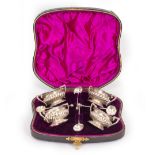 A SILVER SALTS SET in case, with marks for Birmingham 1886