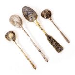 THREE RUSSIAN WHITE METAL TEASPOONS with Niello work decoration and a further Russian white metal