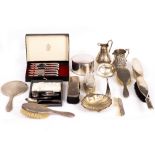 A COLLECTION OF SILVER to include silver backed brushes, a dressing table set, a silver plated