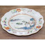 AN 18TH CENTURY CHINESE FAMILLE ROSE PORCELAIN PLATE with a shaped edge, 23cm diameter