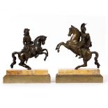 A PAIR OF CAST BRONZE SCULPTURES OF HORSEMEN their horses rearing and both on rectangular stepped