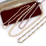 A 9 CARAT GOLD AND PEARL NECKLACE, a pearl and coral necklace and two further pearl necklaces