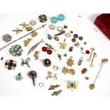 A COLLECTION OF COSTUME JEWELLERY mainly various brooches together with some earrings