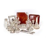 A COLLECTION OF SILVER AND SILVER MOUNTED ITEMS to include bottles and jars, various candlesticks