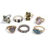 A YELLOW METAL AND GREEN STONE RING stamped 750, a moonstone set ring and further dress rings