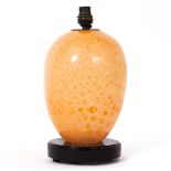 AN ART GLASS LAMP with an ebonised turned base, 31cm high