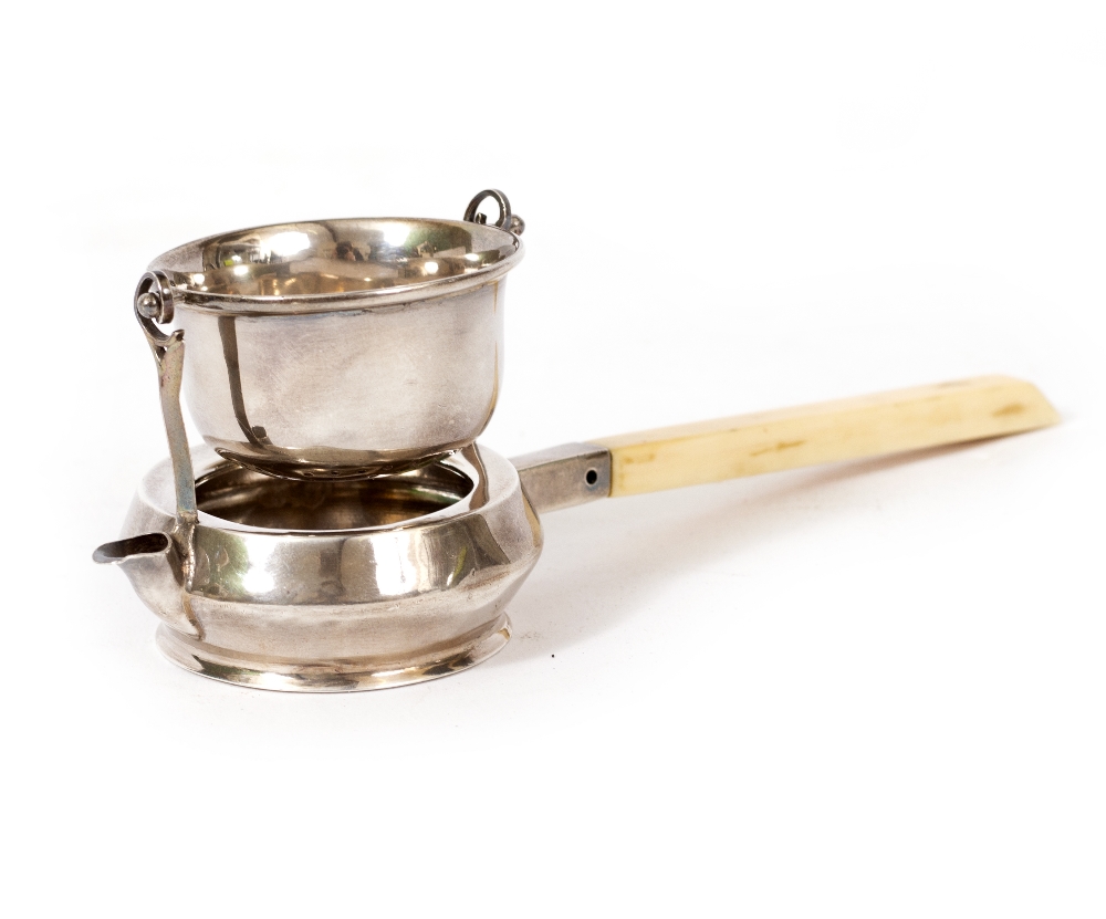 AN EARLY 20TH CENTURY SILVER TEA STRAINER with an ivory handle by Fredericks Limited and retailed by