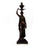 A BRONZE AND BLACK SLATE TABLE LAMP in the form of a cast classical caryatid figure, 17cm wide x