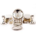 A PAIR OF SILVER CANDLESTICKS together with a silver mounted ashtray, a toast rack, white metal