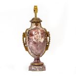 A PURPLE MARBLE TABLE LAMP with gilt metal lamps in the form of a classical vase, 20cm wide x 46cm