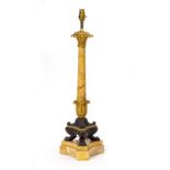 A TABLE LAMP with gilt brass and bronze mounts, in the form of a classical marble column with paw