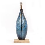 A BLUE GLASS BODIED TABLE LAMP with square painted wooden base, 52cm high