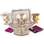 A GROUP OF SILVER PLATE consisting of an oval tray, salver and a further tray, wine coolers, table