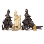 TWO SIMILAR CAST BRONZE SCULPTURES of wise men riding on the back of carp together with an antique
