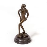 A BRONZE FIGURE OF A STANDING FEMALE NUDE the rocky base impressed 'Aldo Vitaleh', on a circular