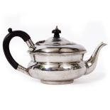 AN EARLY 20TH CENTURY SILVER BACHELORS TEAPOT with an ebony finial and handle, with marks for London