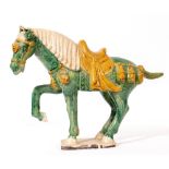 A TANG STYLE GLAZED POTTERY HORSE 40cm high