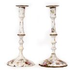 A PAIR OF LATE 18TH CENTURY ENGLISH ENAMELLED CANDLESTICKS with hand painted floral decoration, 15cm