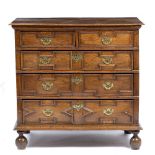 AN ANTIQUE 17TH CENTURY STYLE OAK CHEST OF TWO SHORT AND THREE LONG DRAWERS with geometric