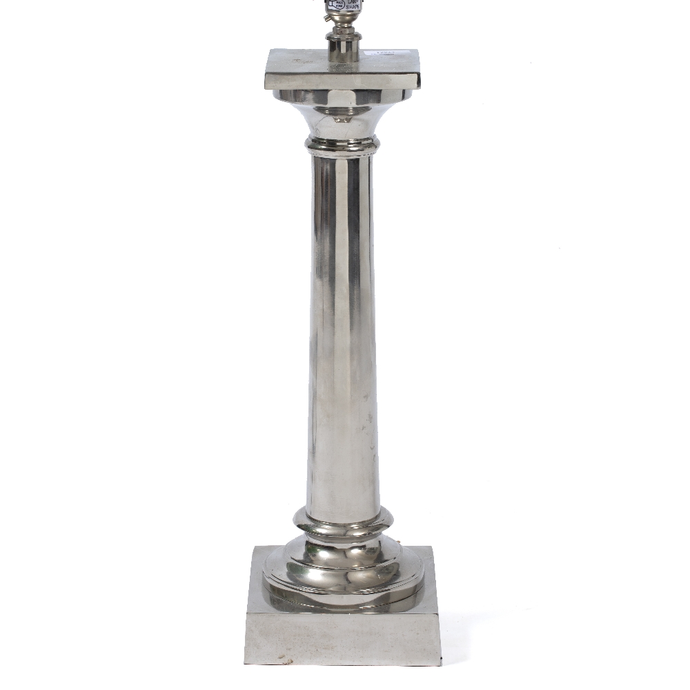 A SILVERED METAL TABLE LAMP in the form of a classical column of square base, 16cm wide x 57cm high