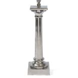 A SILVERED METAL TABLE LAMP in the form of a classical column of square base, 16cm wide x 57cm high