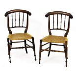 A PAIR OF MID VICTORIAN ROSEWOOD CHILD'S CHAIRS with scroll terminals to the cresting rails,