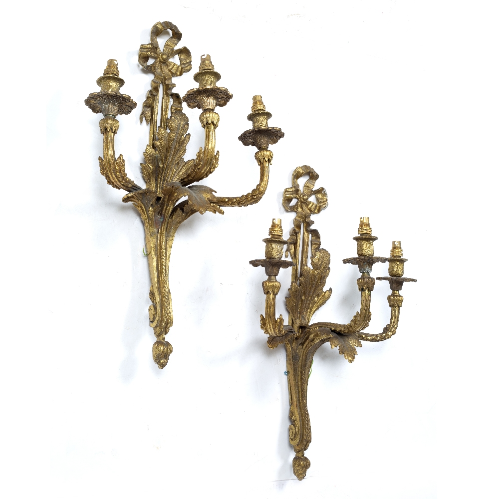 A PAIR OF 18TH CENTURY STYLE ORMOLU THREE BRANCH WALL LIGHTS with ribbon tied decoration and