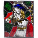 A MEDIEVAL STYLE STAINED GLASS WINDOW PANEL with a head and shoulder portrait of a bearded