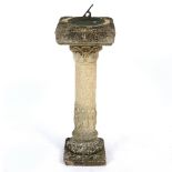 A COMPOSITE STONE SUNDIAL the column with geometric decoration and Greek figures, overall 83cm high