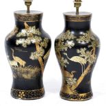 A PAIR OF BLACK LACQUERED CHINOISERIE DECORATED BALUSTER TABLE LAMPS each 23cm diameter and standing