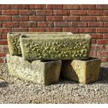 A SET OF FOUR RECONSTITUTED STONE RECTANGULAR PLANTERS OR TROUGHS decorated with shells, 77cm wide x