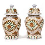 A PAIR OF CHINESE BALUSTER VASES AND COVERS each 27cm diameter x 52cm high