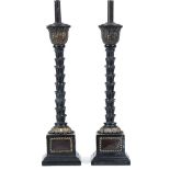 A PAIR OF BLACK PAINTED AND PARCEL GILT TABLE LAMPS the central supports in the form of palm tree