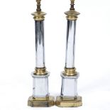 A PAIR OF SILVERED METAL TABLE LAMPS in the form of classical columns on plinth bases, 13.5cm wide x