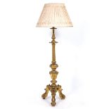 A GILT CARVED WOOD LAMP STANDARD with fluted column support and scrolling tripod base, 159.5cm