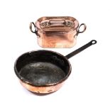 AN ANTIQUE COPPER PAN with wrought iron handle and a twin handled oval lidded copper dish (2)